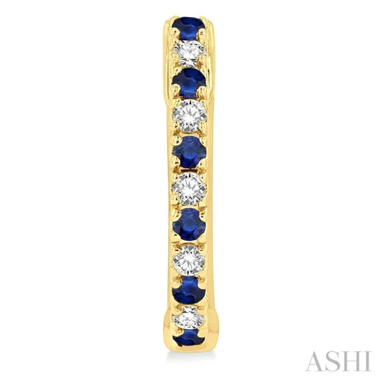 1/10 ctw Petite 1.35MM Sapphire and Round Cut Diamond Precious Fashion Huggies in 10K Yellow Gold